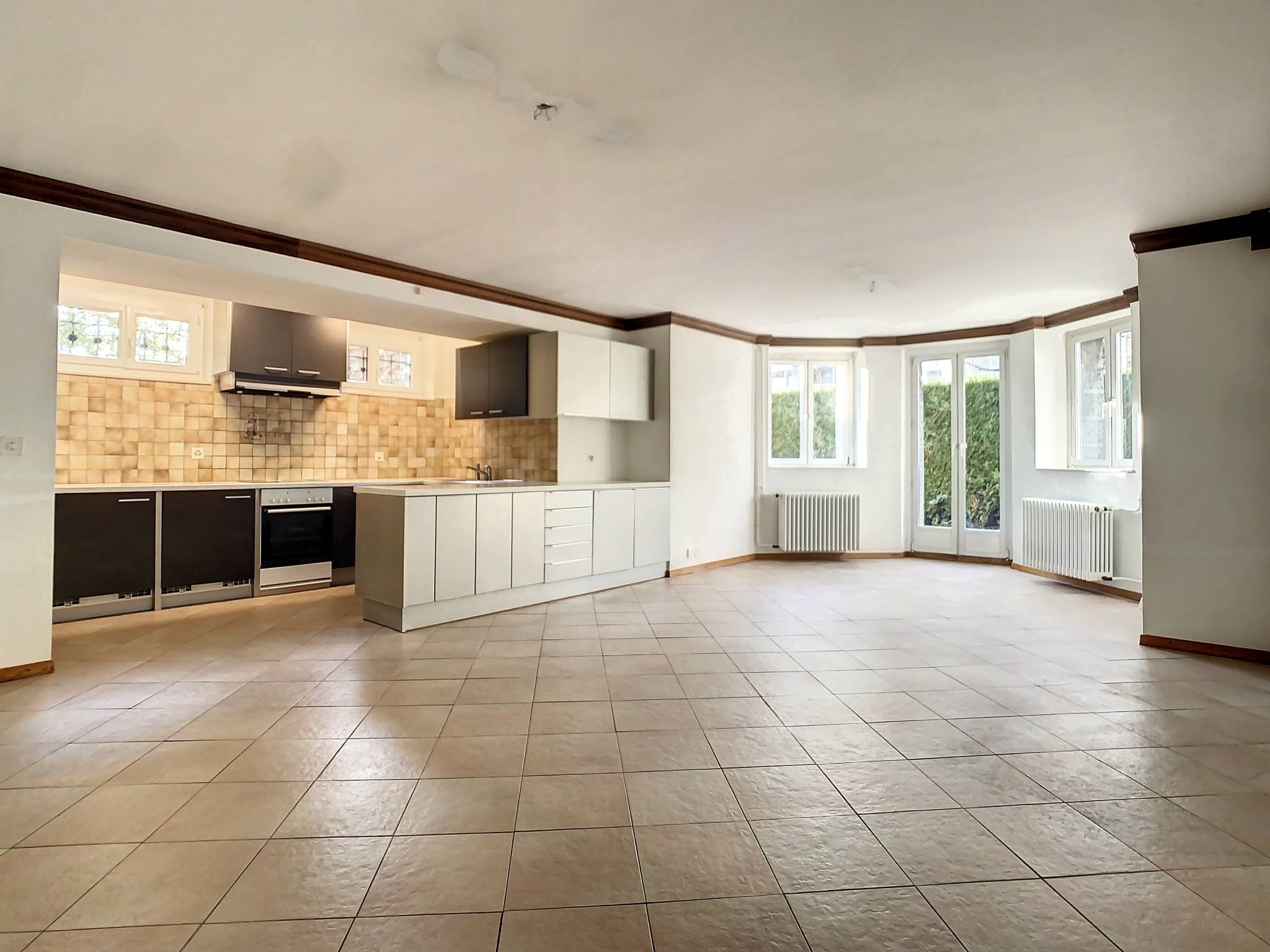 Appartement à rénover avec jardin privatif au coeur de la ville